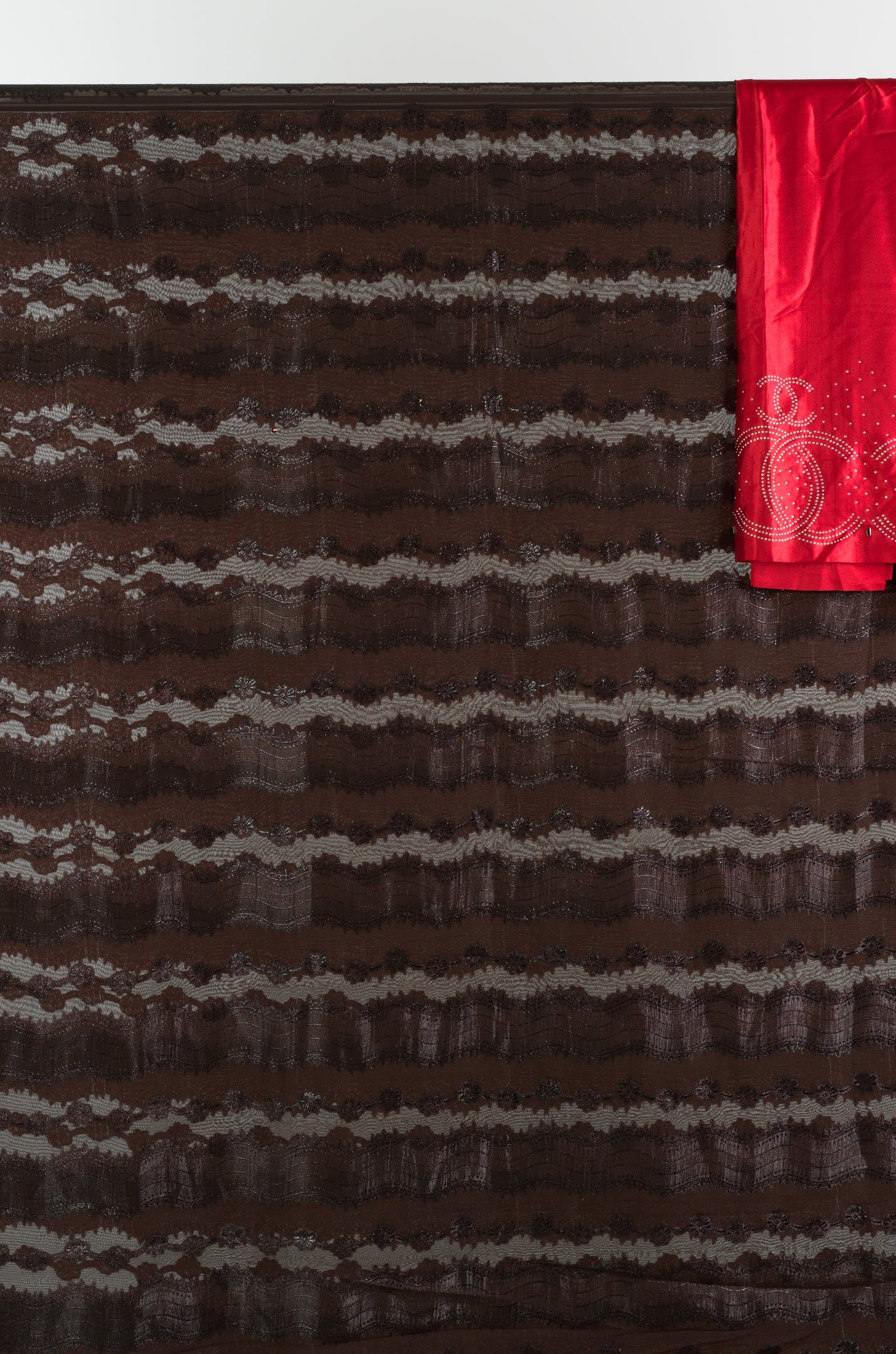 Brown and red floral Sharaax Dirac Kabayare