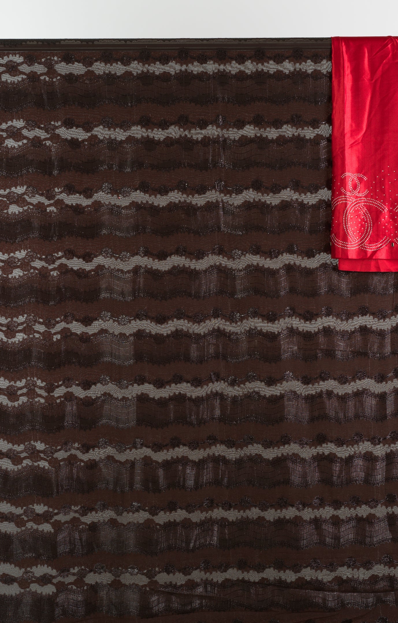 Brown and red floral Sharaax Dirac Kabayare