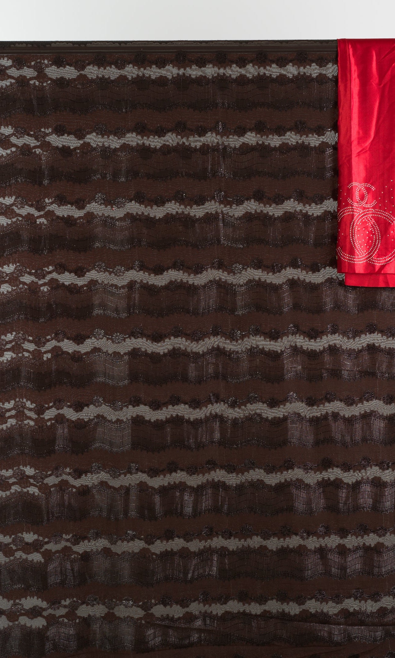 Brown and red floral Sharaax Dirac Kabayare