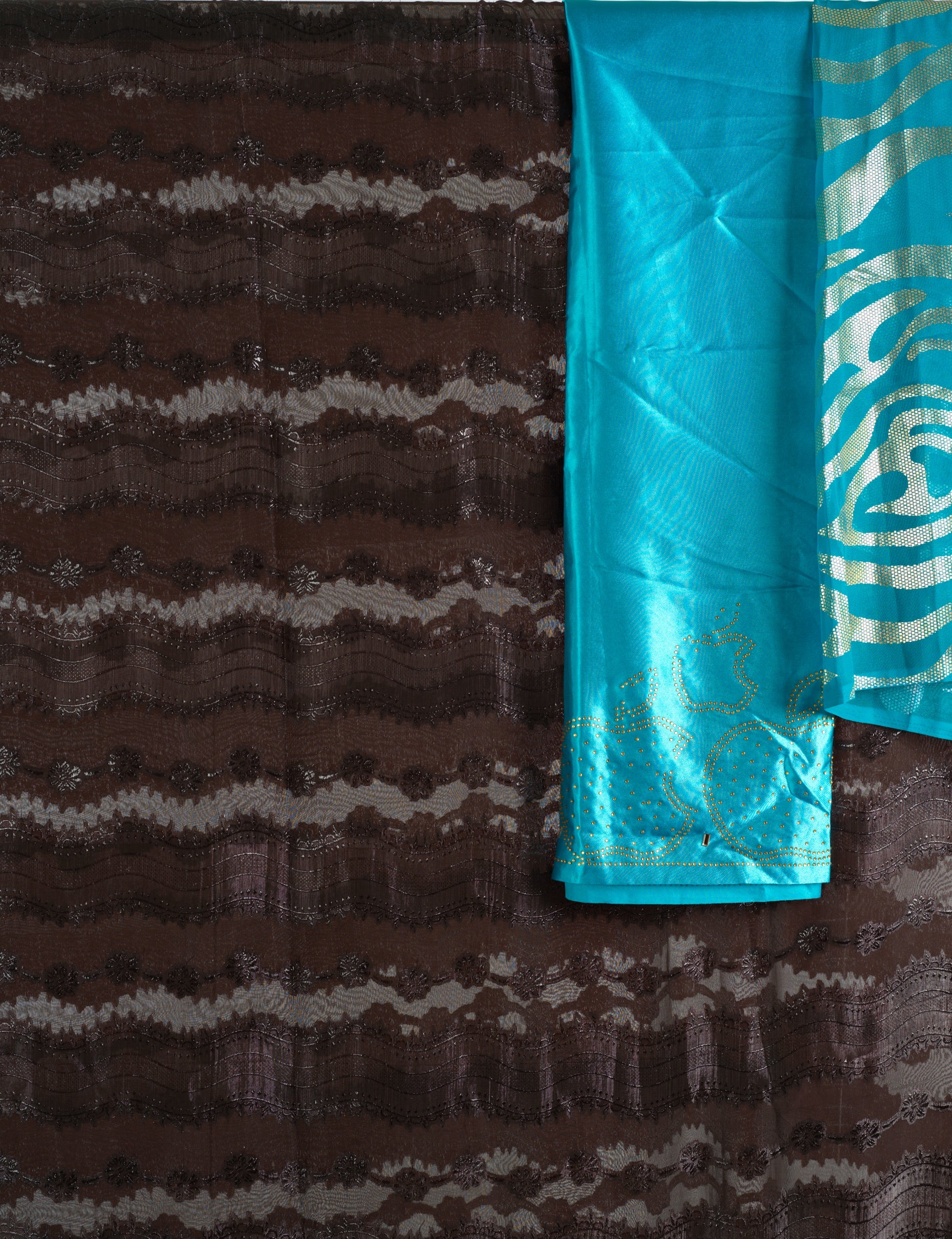 Brown and sea blue floral Sharaax Dirac Kabayare